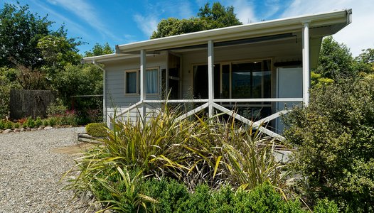 Enjoy the views of the garden from your Marahau chalet